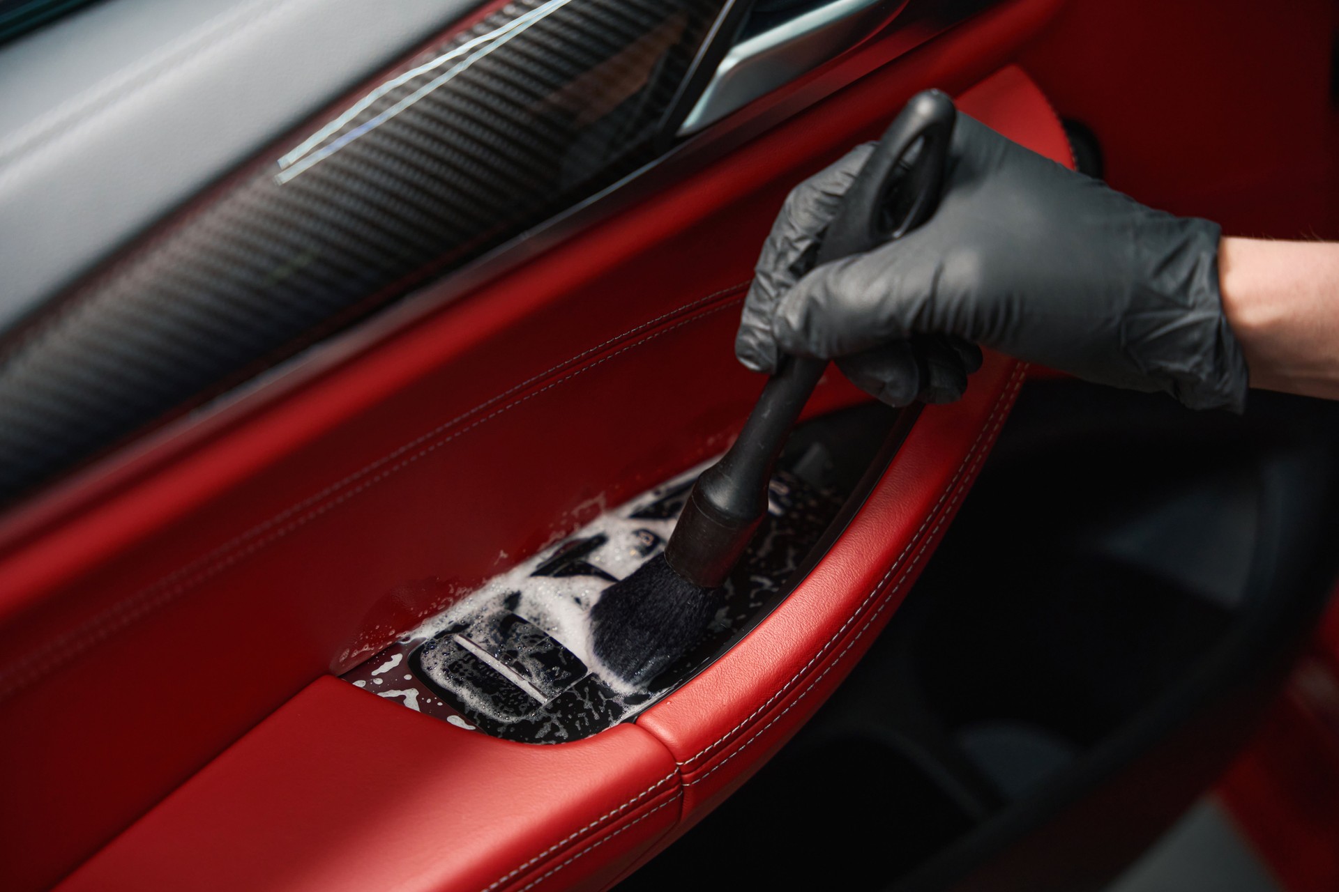 Professional auto detailing professional is cleaning car interior